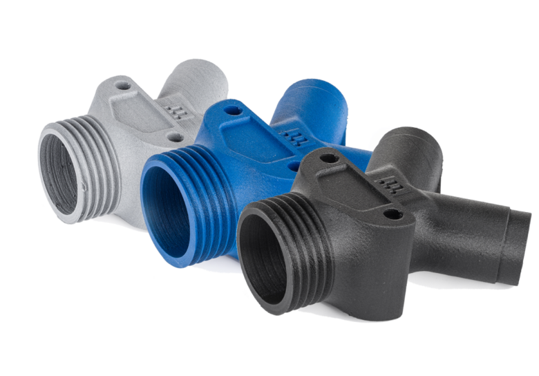 Three 3D-printed parts demonstrating Ultimaker's PET CF colors: gray, blue, and black.